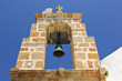 Detail of a church belltower with cross in Lindos