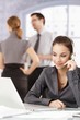 Attractive dispatcher talking on headphones