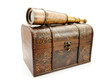 Photo: Antique spyglass and a wooden chest. Antique spyglass and a wooden chest.