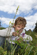 boy with magnifying glass outdoors boy with magnifying glass outdoors