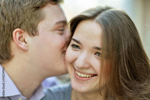 Photo: couple whispering couple whispering