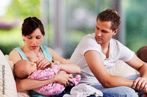 Foto: young couple with 7 week old baby young couple with 7 week old baby