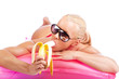 Cute blond model is lying on pink mattress