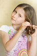 girl braids her hair girl braids her hair