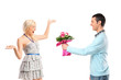 Boyfriend giving flowers to his surprised girlfriend