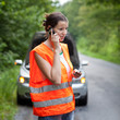 Young female driver calling for help