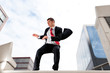 Jumping young business man