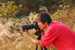 photographer taking photo in country side