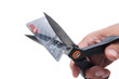Photo: Scissors cutting credit card Scissors cutting credit card