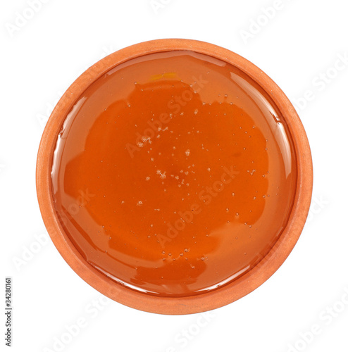 Photo: Small dish filled with honey Small dish filled with honey