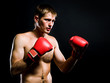 Portrait of young man with boxing  gloves