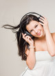 Happy relaxed brunette listening to music.