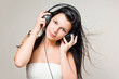 Happy relaxed brunette listening to music.