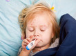 a sick girl is measuring the temperature