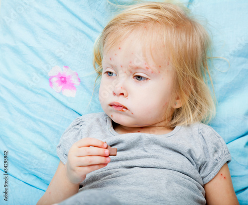 Photo: Sick girl is eating chocolate Sick girl is eating chocolate