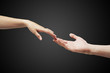male and female hands (palms) stretch to each other male and female hands (palms) stretch to each other