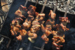 Fried meat on the grill with onions on skewers, barbecue Fried meat on the grill with onions on skewers, barbecue