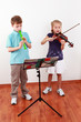 Kids playing flute and violin
