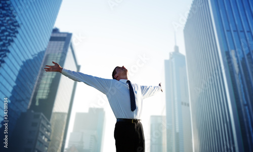 Photo: happy young businessman and big city happy young businessman and big city