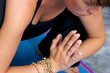 Photo: close up of woman in yoga garland pose close up of woman in yoga garland pose