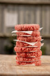 Raw burgers for hamburgers, in a pile