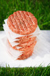 Raw burgers for hamburgers, in a pile