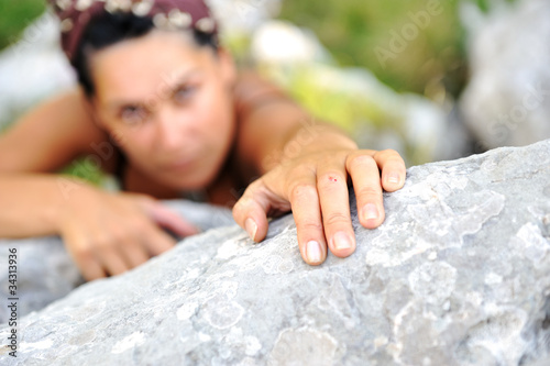 Photo: Female climbing the rock on mountain Female climbing the rock on mountain