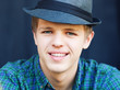 Close-up portrait of a young handsome man in a black hat . Close-up portrait of a young handsome man in a black hat .