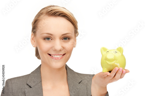 Photo: lovely woman with piggy bank lovely woman with piggy bank