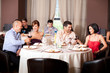 young people toasting restaurant table young people toasting restaurant table