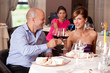 young couple toasting restaurant table young couple toasting restaurant table
