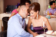 young couple flirting at restaurant table young couple flirting at restaurant table