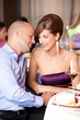 young couple flirting at restaurant table
