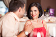 young couple flirting at restaurant table