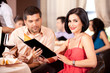 young couple ordering food restaurant table young couple ordering food restaurant table