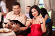 young couple calling waiter restaurant table