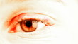 Glowing red female eye