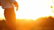 Golf player teeing off on a beautiful golf course at sunset