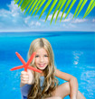 children blond girl in summer vacation tropical beach