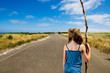 child looking down a long road