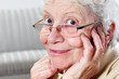 Photo: aged woman with glasses and hearing aid aged woman with glasses and hearing aid
