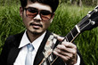 guitarist at field lanscape