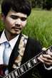 guitarist at field lanscape