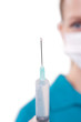 Photo: syringe in doctor's hand syringe in doctor's hand