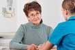 Photo: Doctor and patient discussing Doctor and patient discussing