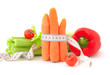 Carrots with tape measure and vegetables