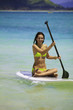 young woman on a standup paddle board