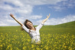 Happy woman in rapeseed field