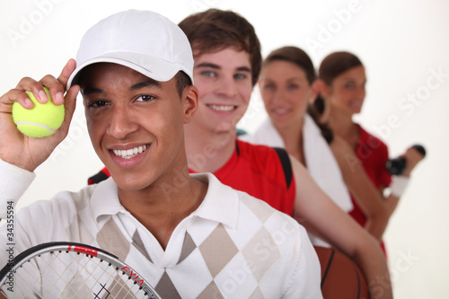 Foto: Four young people illustrating different sports Four young people illustrating different sports