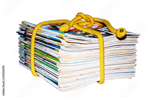 Photo: a stack of magazines on the rope a stack of magazines on the rope